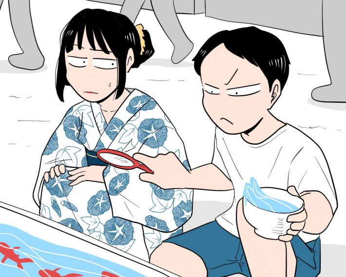 金魚すくいに熱中する彼